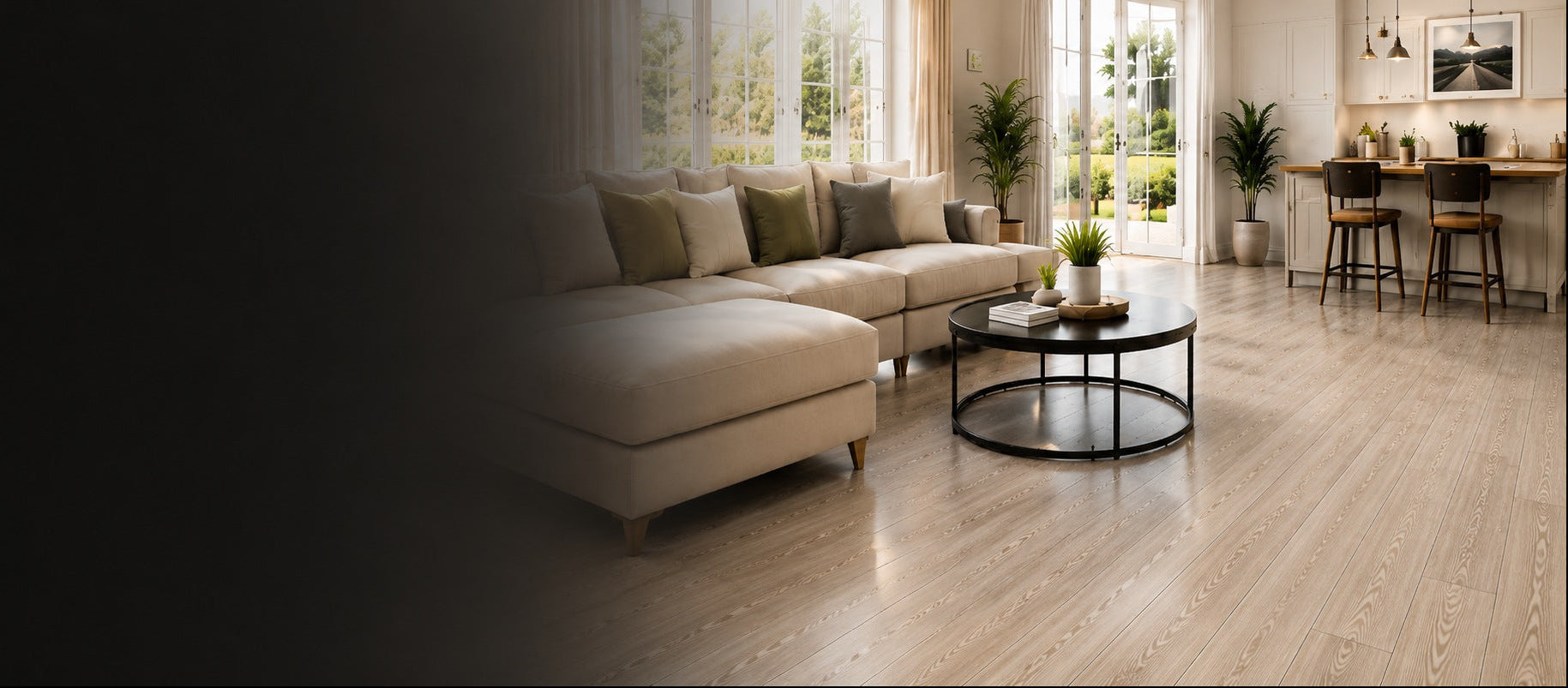 Modern living room with beige sectional sofa, round coffee table, and wooden floor.